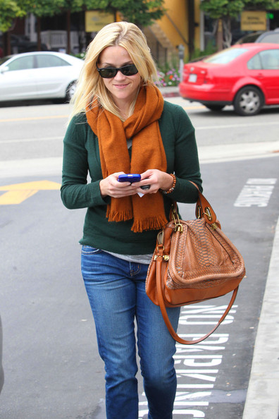 reese witherspoon gives up snakeskin python chloe bag