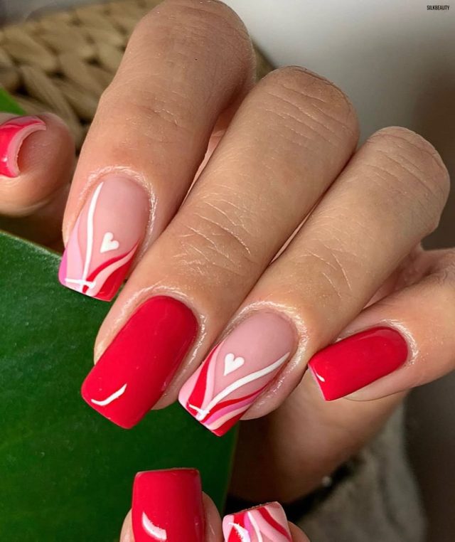 Dainty white hearts on pink short nails
